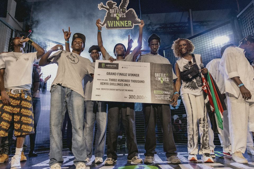 The 2025 grand finale winners on stage holding their KSh 300,000 cheque.